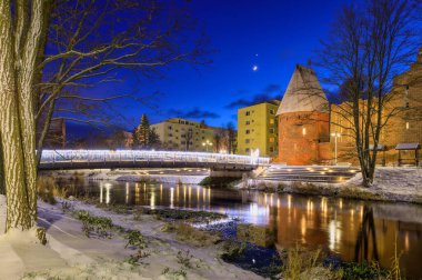 Winter scenery of the city of Slupsk at dusk, Poland. clipart