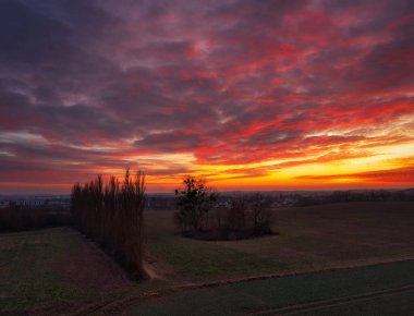 Amazing sunset over the spring fields of Rotmanka, Poland clipart