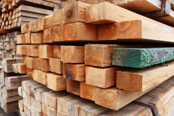 Wooden logs stacked and creating a beautiful background, ready to be used in construction. AI generative