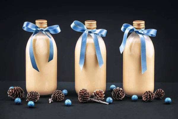 Three Bottles Homemade Eggnog Blue Bows Pine Cones Blue Balls — Stock Photo, Image