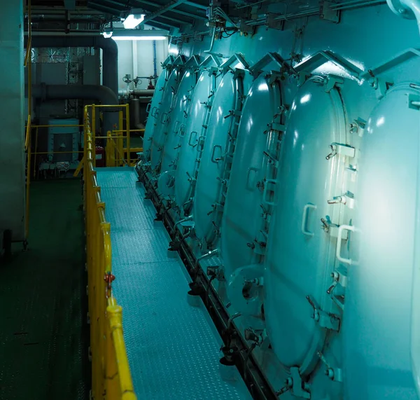 Ship\'s engine room. Vessel\'s ( Ship ) Engine Room Space industrial stairs. Ship\'s Engine Heavy Machinery Space - Pipes, Valves, Engines