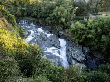 river and waterfall. on Via Francigena tourist route.in bagnone clipart