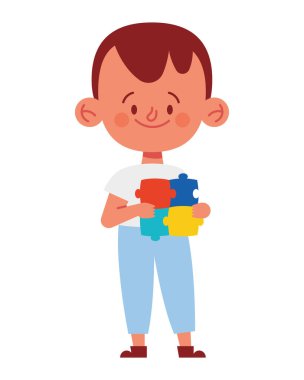 Yapboz parçaları olan otistik çocuk.