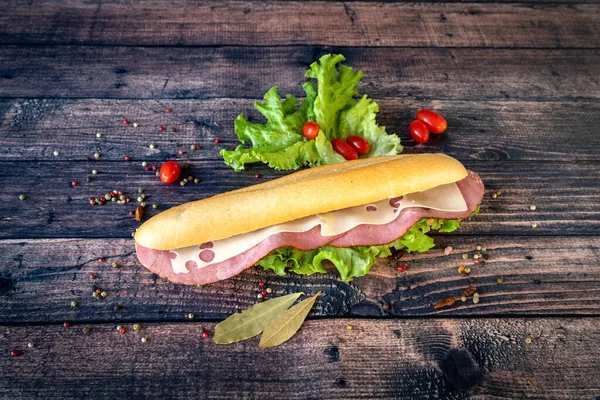 goot meat and fast food. Sandwich on a wooden background