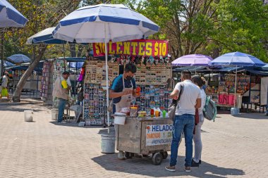 MEXICO CITY, MEXICO. March 24, 2022: Treats stand iwith batanas, chips, maxican snachs n Chapultepec park, Mexico City, Mexico,
