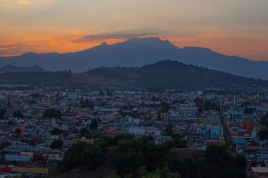 View on th Popocatepetl Volcano during sunset from the ancient pyramid of Cholula, Mexico