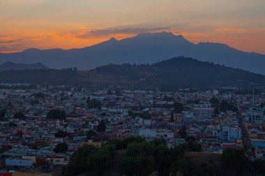 View on th Popocatepetl Volcano during sunset from the ancient pyramid of Cholula, Mexico