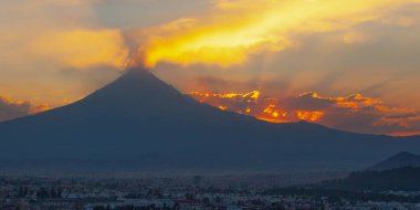 View on th Popocatepetl Volcano during sunset from the ancient pyramid of Cholula, Mexico