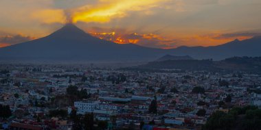 View on th Popocatepetl Volcano during sunset from the ancient pyramid of Cholula, Mexico