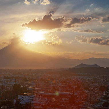 View on th Popocatepetl Volcano during sunset from the ancient pyramid of Cholula, Mexico