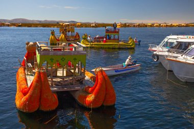 Uros, Peru - April 29, 2022: Traditional reed boat as transportation for tourists, Islas es los Uros, Lake Titicaca, Peru