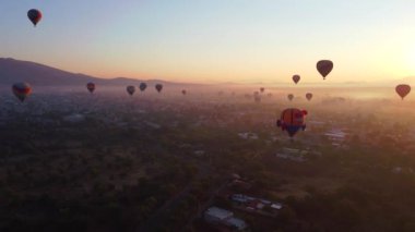 Sunrise on hot air balloon over the Teotihuacan pyramid