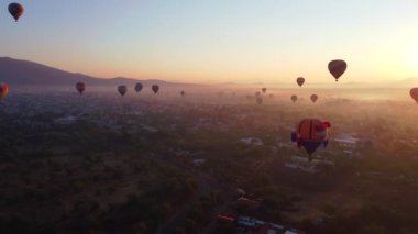 Sunrise on hot air balloon over the Teotihuacan pyramid