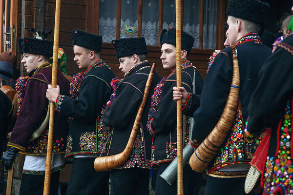 Kryvorivnya, Ukraine - January 6, 2024: Gutsuls (highlanders in Carpathian mountains) are singing Christmas Carols (Kolyadki)  in Kryvorivnya, Ukraine.