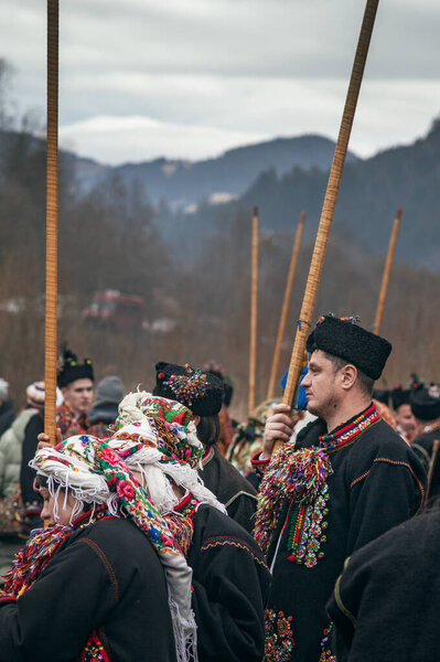 Kryvorivnya, Ukraine - JANUARY 6, 2024: Gutsuls (highlanders in Carpathian mountains) are singing Christmas Carols (Kolyadki)  in Kryvorivnya, Ukraine.