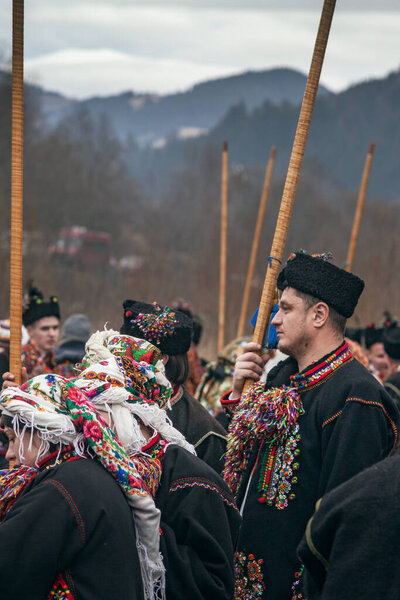 Kryvorivnya, Ukraine - JANUARY 6, 2024: Gutsuls (highlanders in Carpathian mountains) are singing Christmas Carols (Kolyadki)  in Kryvorivnya, Ukraine.