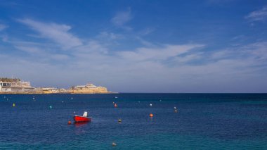 Saint Julian Bay with traditional colourful fishing Boats Luzzu, Malta clipart