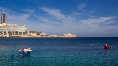 Malta - 9 Feruary, 2024: Saint Julian Bay with traditional colourful fishing Boats Luzzu, Malta clipart