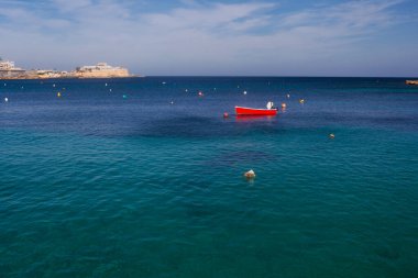 Saint Julian Bay with traditional colourful fishing Boats Luzzu, Malta clipart