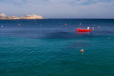Malta - 9 Feruary, 2024: Saint Julian Bay with traditional colourful fishing Boats Luzzu, Malta clipart