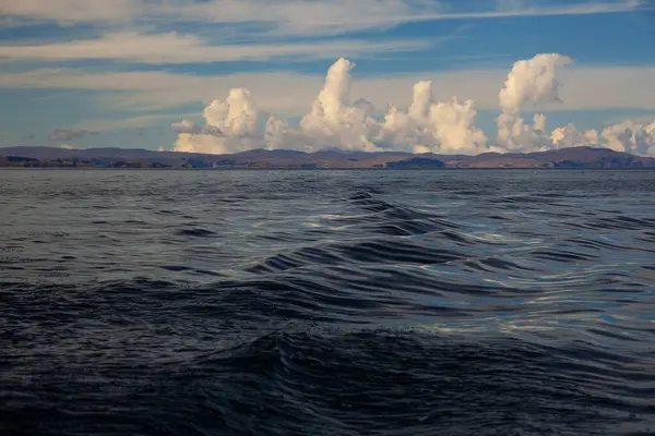 stock image Beautiful titicaca lake and Andes mountains at sunset time , taken from the ship  during the tour from  Puno, Peru