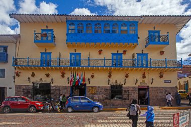 Cusco, Peru - May 13, 2022:  Colonial houses white buildings with colored balconies near  Plaza de Armas square in Cuzco, Peru. clipart