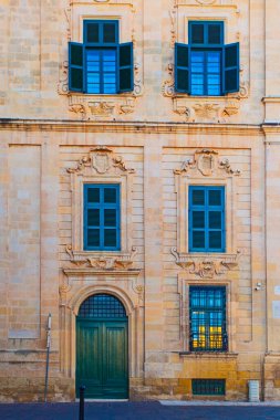 Valletta, Malta - February 13, 2024:  Valletta old town with Maltese colorful balconies, shops and  touristic restaurants taken in the center  clipart