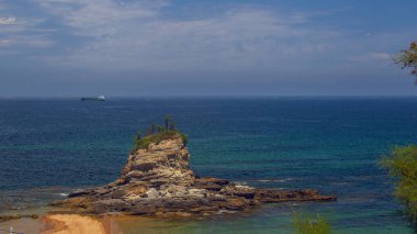 View of the Playa del Camello (Camel Beach), with a rock shaped like a camel, near the Magdalena Peninsula in Santander, Cantabria, Spain. clipart