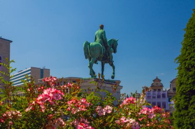 Brussels. Belgium - June 4, Brussels, Belgium - June 4, 2022:Statue of HM King Albert I at the Mont des Arts with the statue of Godefroid de Bouillon in summer clipart