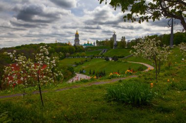 Kyiv city view flom park Slavy ( immortal glory) with tulips flowerbe clipart