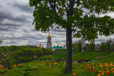 Kyiv city view flom park Slavy ( immortal glory) with tulips flowerbe clipart