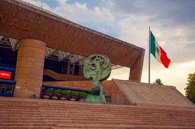 Mexico City - 15 March, 2022: National Auditorium (Spanish: Auditorio Nacional) at Polanco neighborhood with a few people on a beautiful sunny afternoon clipart