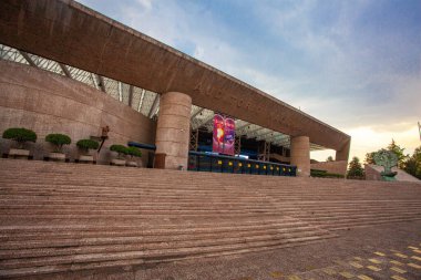 Mexico City - 15 March, 2022: National Auditorium (Spanish: Auditorio Nacional) at Polanco neighborhood with a few people on a beautiful sunny afternoon clipart