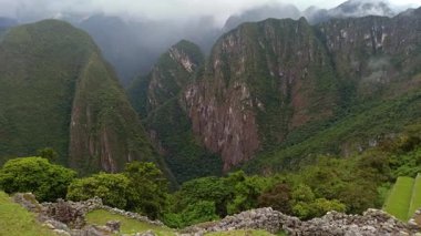Machu Picchu ancient city view from Huchu'y Picchu in cloudy weather