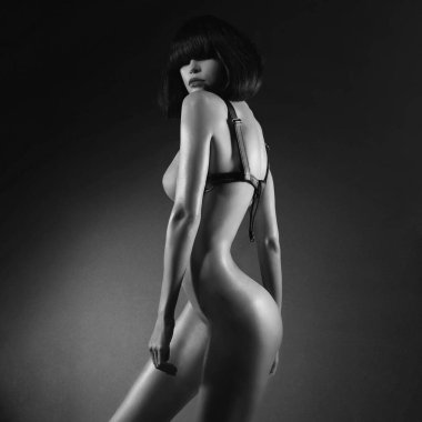 Erotik fetişi olan seksi genç kadın gece kulübünde striptiz yapıyor. Güzel, çıplak, şehvetli, zarif bir kadın..