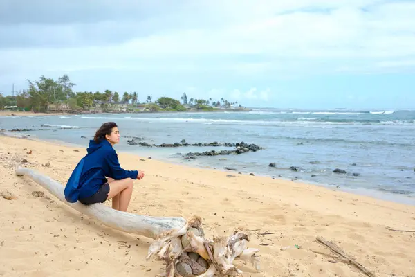 Young Teen Girl Sitting Alone Log Beach Looking Out Ocean Imagem De Stock