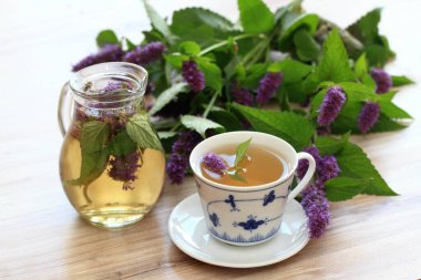 Herbal tea from medicinal herb Agastache foeniculum, also called  giant hyssop or Indian mint. Aromatic agastache tea is good for the stomach and lungs. clipart