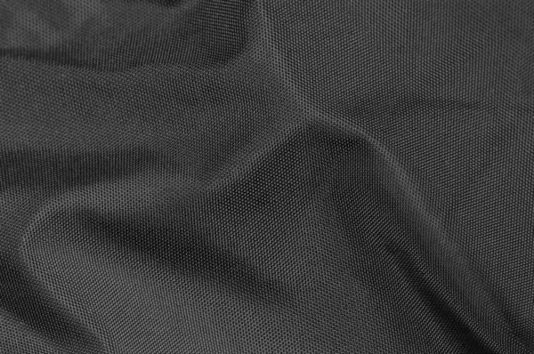黑色折皱天然尼龙面料纹理图案细部 大型细密纹理水平折皱纺织品短裙背景宏观特写 免版税图库图片