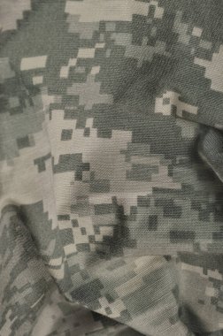 Evrensel kamuflaj desenli savaş üniforması dijital kamuflaj, Amerikan askeri ACU UCP makro yakın çekim, geniş, dikey doğal ripstop kumaş dokusu arka plan, buruşuk, buruşuk yaprak yeşili, sarı çöl kum teni, kentsel taupe gri NYCO