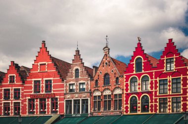 BRUGES, BELGIUM - APRIL 20: Colorful buildings in the main square in Bruges, Belgium on April 20, 2013.