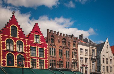 BRUGES, BELGIUM - APRIL 20: Colorful buildings in the main square in Bruges, Belgium on April 20, 2013.