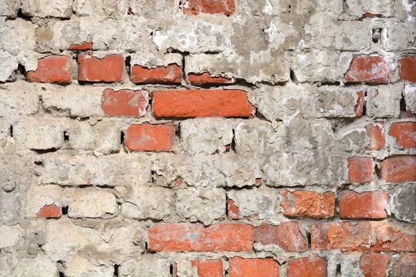 Detail Einer Alten Mauer Mit Rissiger Fassade Und Ziegeln Darunter — Stockfoto