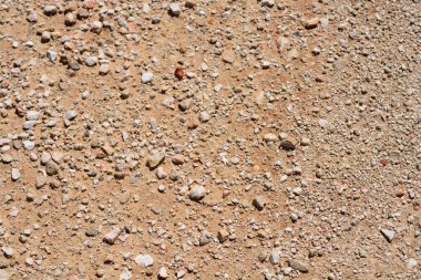Kırmızı toprak yüzeyinin küçük taşlı ayrıntıları