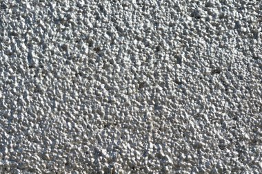 Gümüş boyalı kaba bir duvarın ayrıntıları