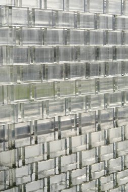 Glass brick wall with reflection in water
