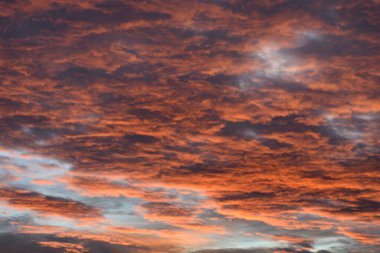 Orange, red and gray clouds in the sky