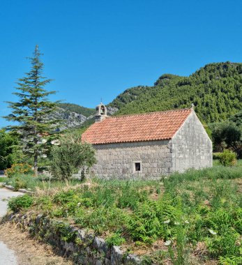 The small Church of St. Julian and St. Roch (Sv. Julijan i Roko) in Zuljana on the Peljesac peninsula, Croatia clipart