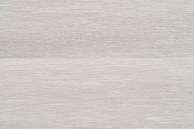 İnce, dalgalı desenli beyaz ve gri krep kağıdının yakın çekim görüntüsü.