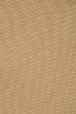 Kalıplı bir kumaşın bej renkli bir görüntüsü, tüm çerçeveyi dolduruyor.