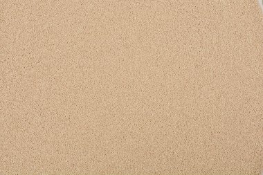 Yakın plan, yukarıdan aşağı kuru maya tanecikleri, tutarlı bir bej rengi ve ince dokuya sahip.